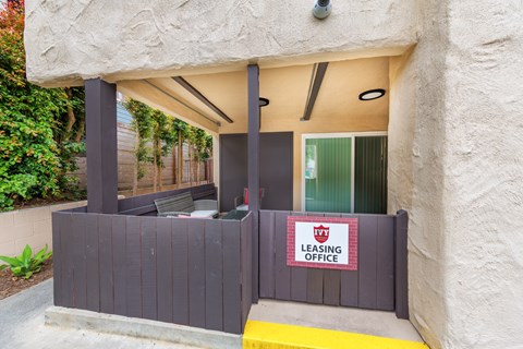 A leasing office is located under a covered walkway.