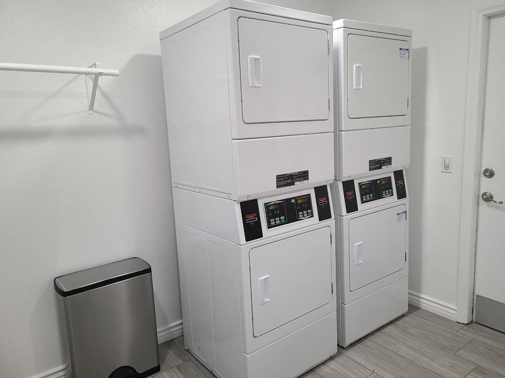 Dryers inside the laundry room at Versailles