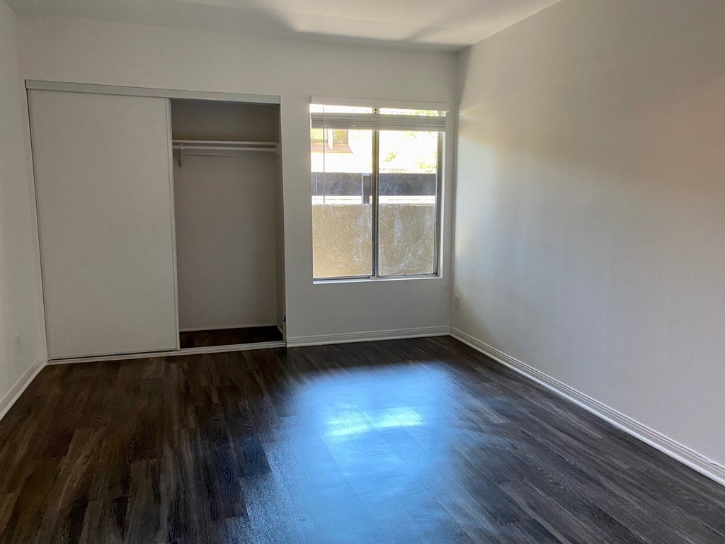 bedroom with window and closet