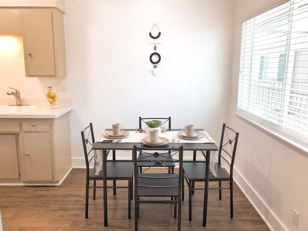 a dining room with a table and chairs