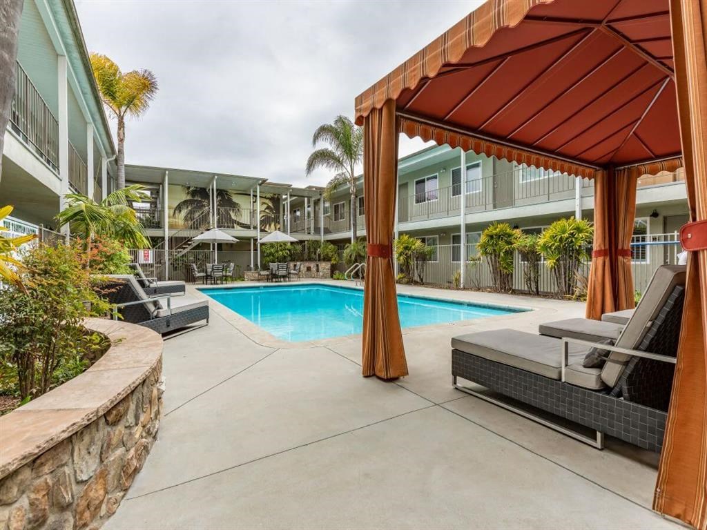 Swimming pool with Cabana and lounge chairs