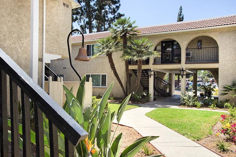 a building with palm trees in front of it