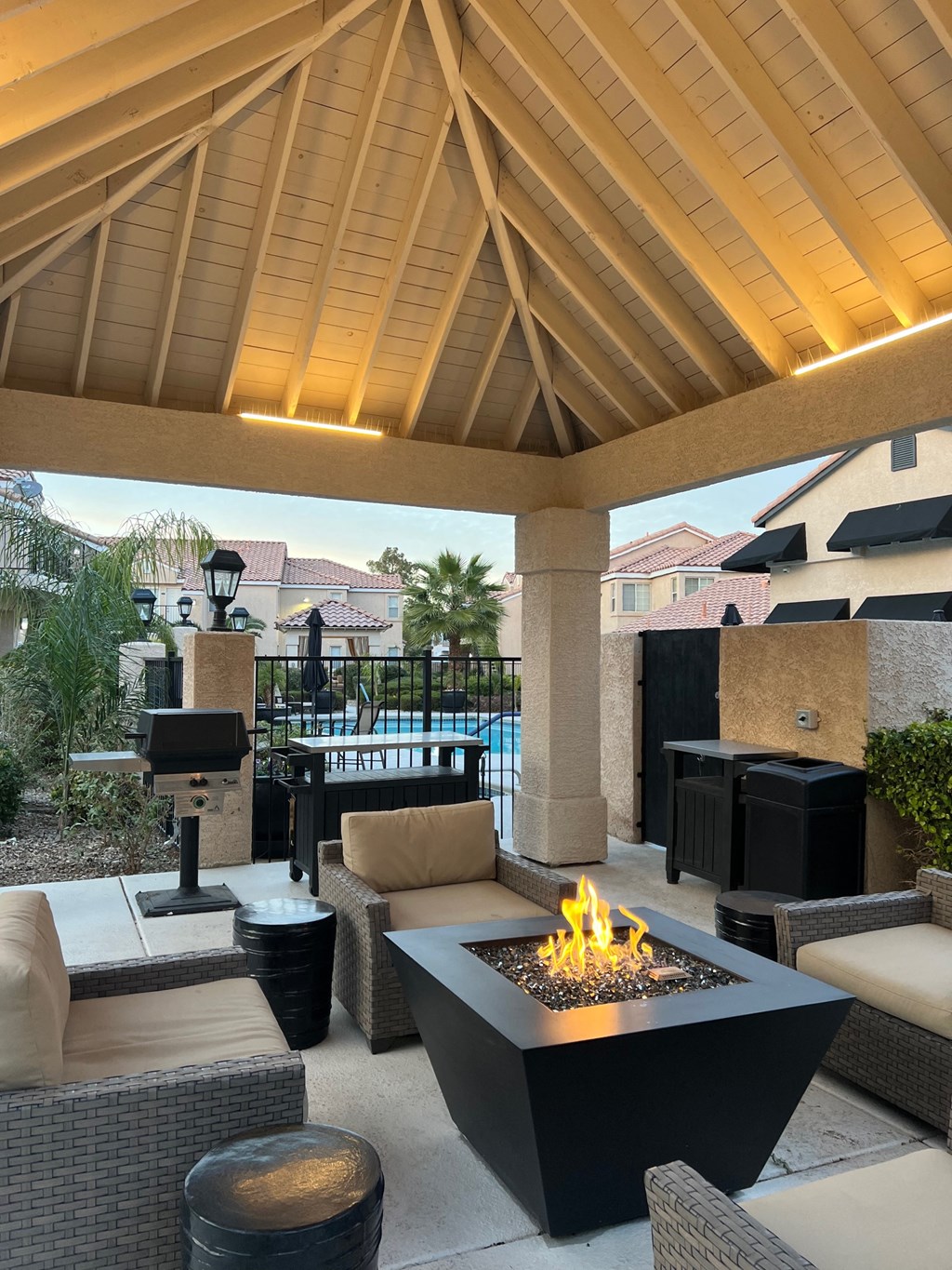 a patio with a fire pit