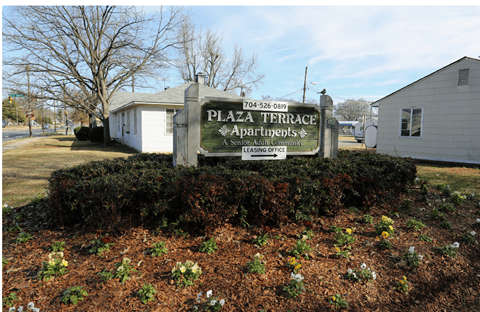 the sign in front of the plaza triangle apartments