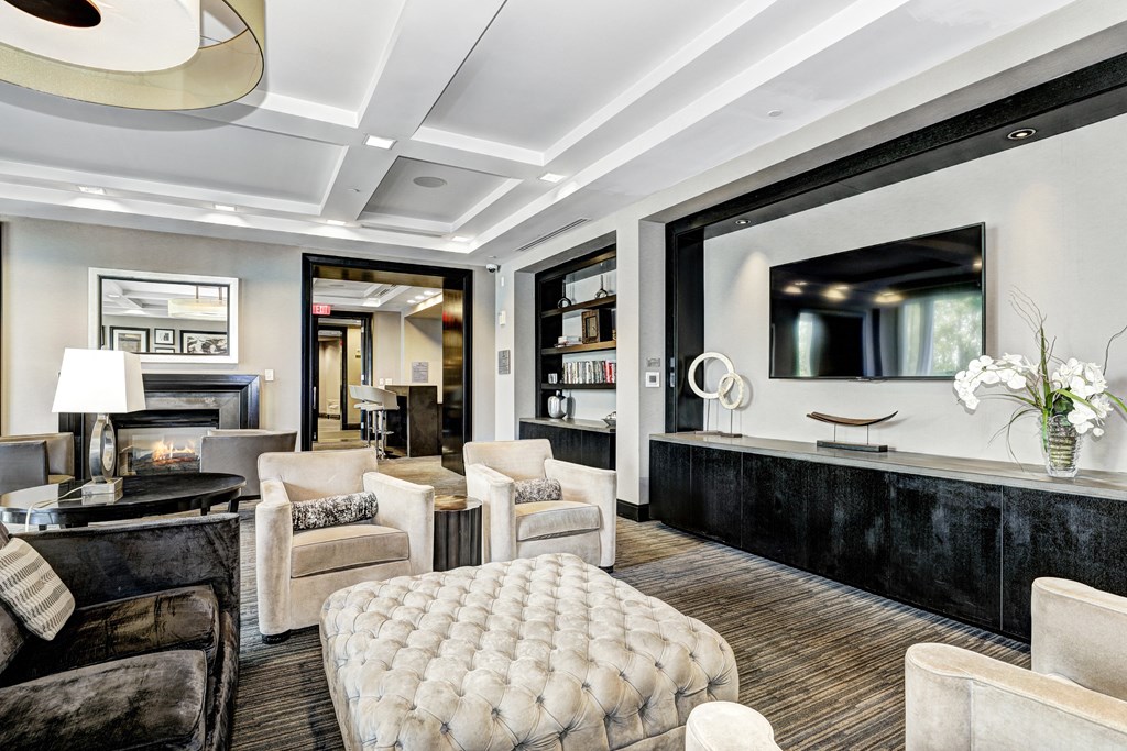 a living room with a table and chairs and a fireplace