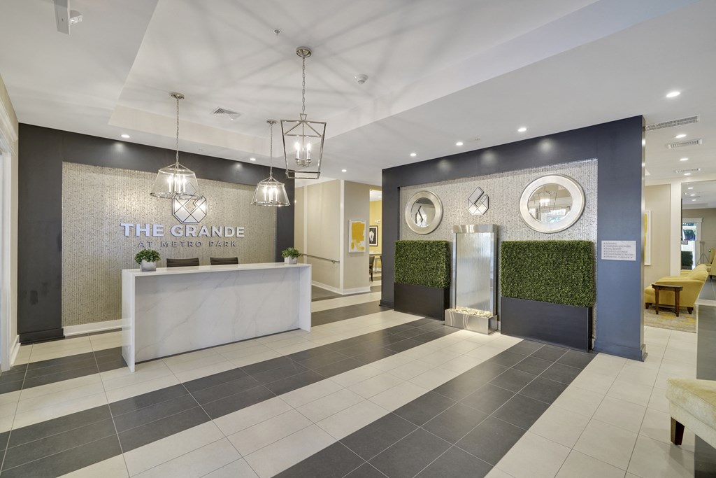 the grange lobby with reception desk and front doors
