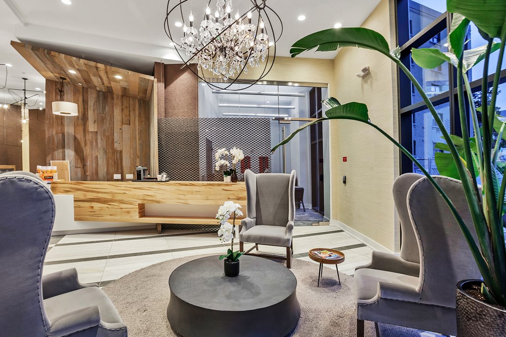 a lobby with two chairs and a coffee table