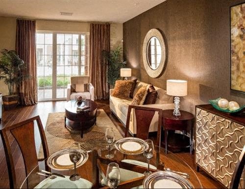 a living room with a table and a couch