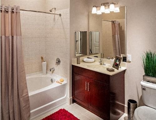 a bathroom with a sink toilet and a bath tub