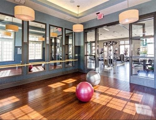 a gym with a yoga ball and other exercise equipment