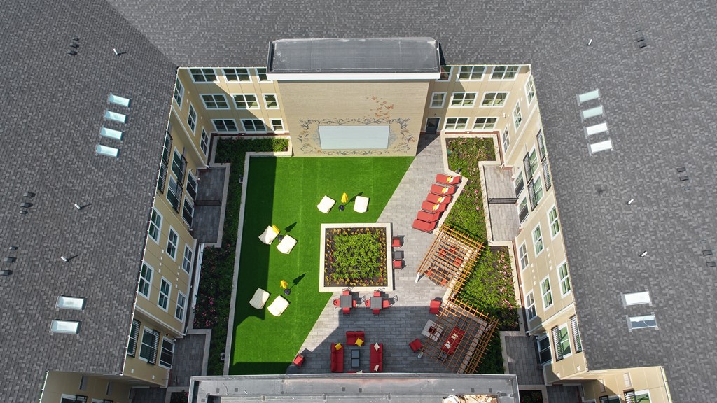 an aerial view of a yard in a building with grass