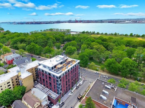 Aerial view of modern apartment building near waterfront at Park Bayonne Apartments, Bayonne, 07002