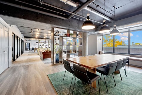 Modern conference room with large wooden table at Bay One Apartments, Bayonne, New Jersey
