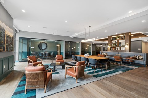 Clubhouse dining area with builtin banquette seating at Aster Grove Apartments, New Jersey