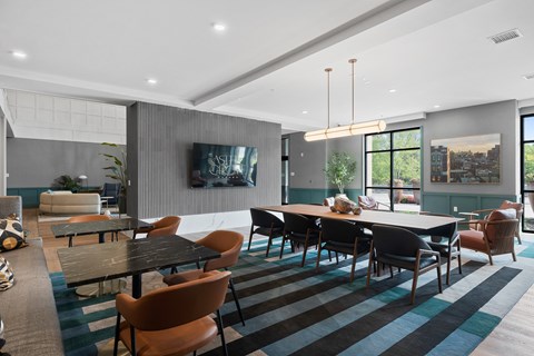 Clubhouse dining area with striped rug and pendant lighting at Aster Grove Apartments, Warren, 07059