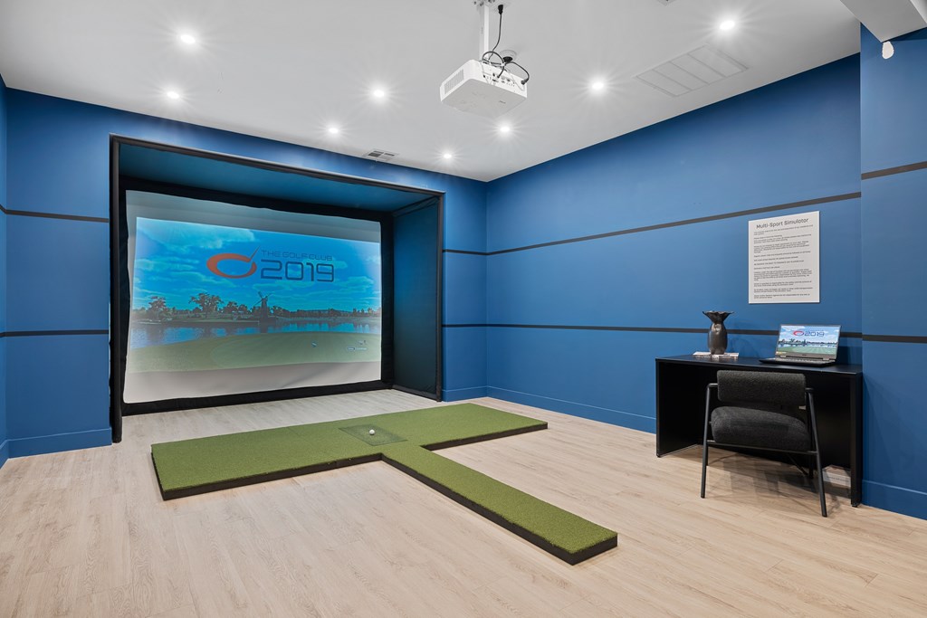 A room with a blue wall and a projection screen displaying the year 2019.