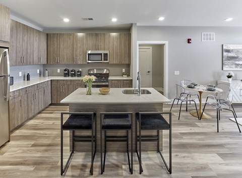 an open kitchen and dining area with a table and chairs