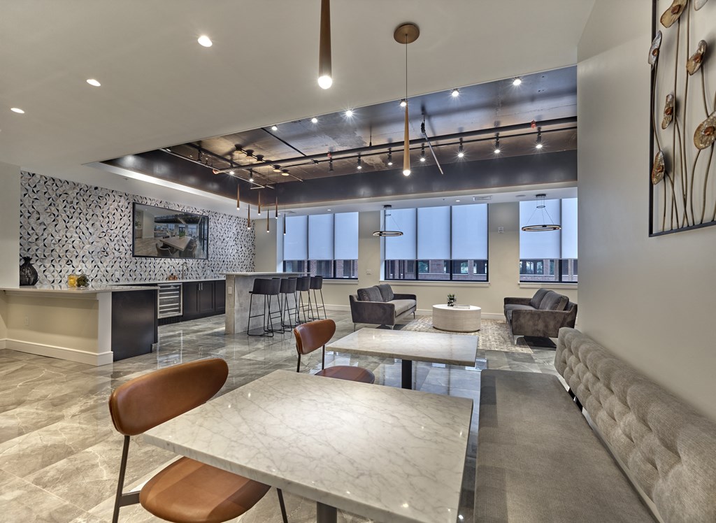 A modern living room with a fireplace and a dining table.