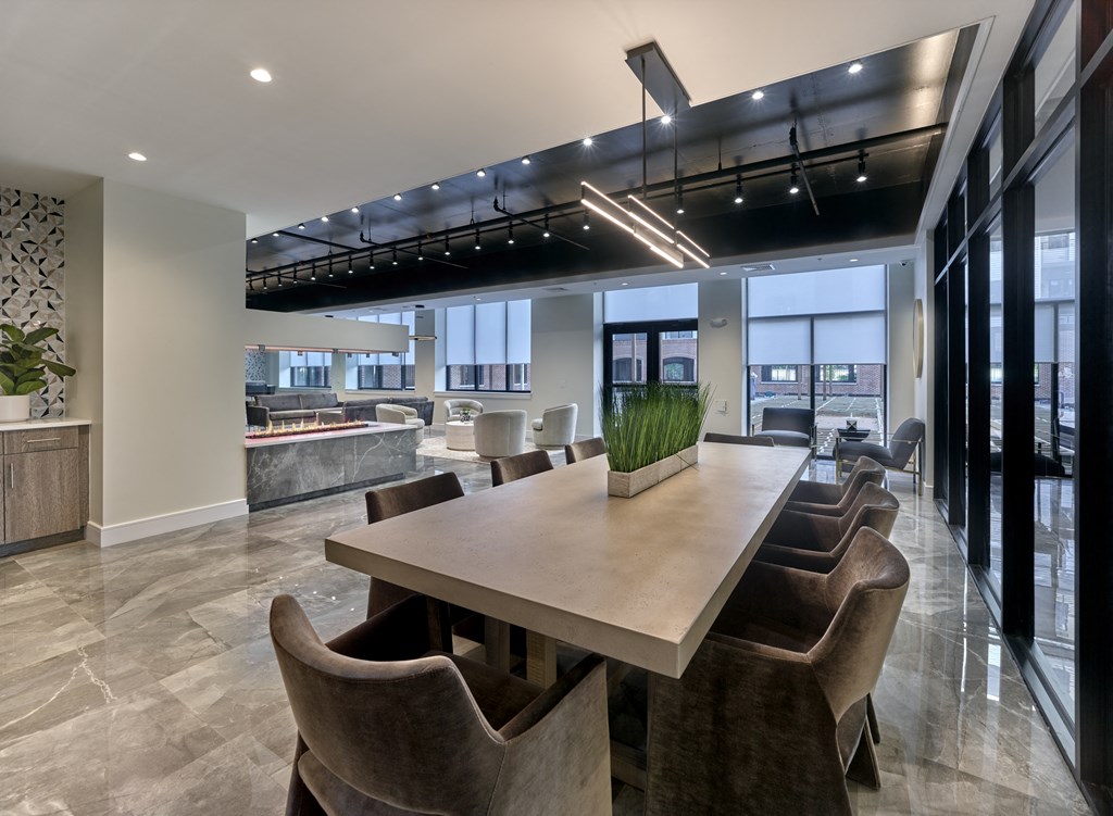 a communal area with a long table and chairs