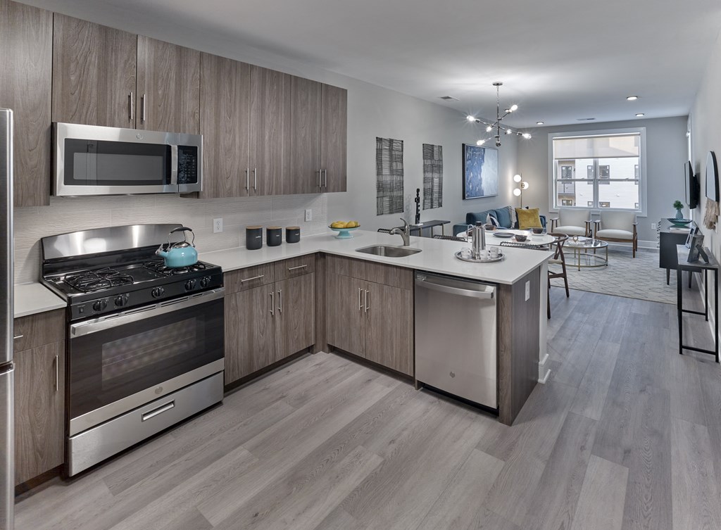 a kitchen with stainless steel appliances and wooden cabinets