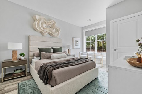 A bedroom with a large bed and a wooden sculpture on the wall.