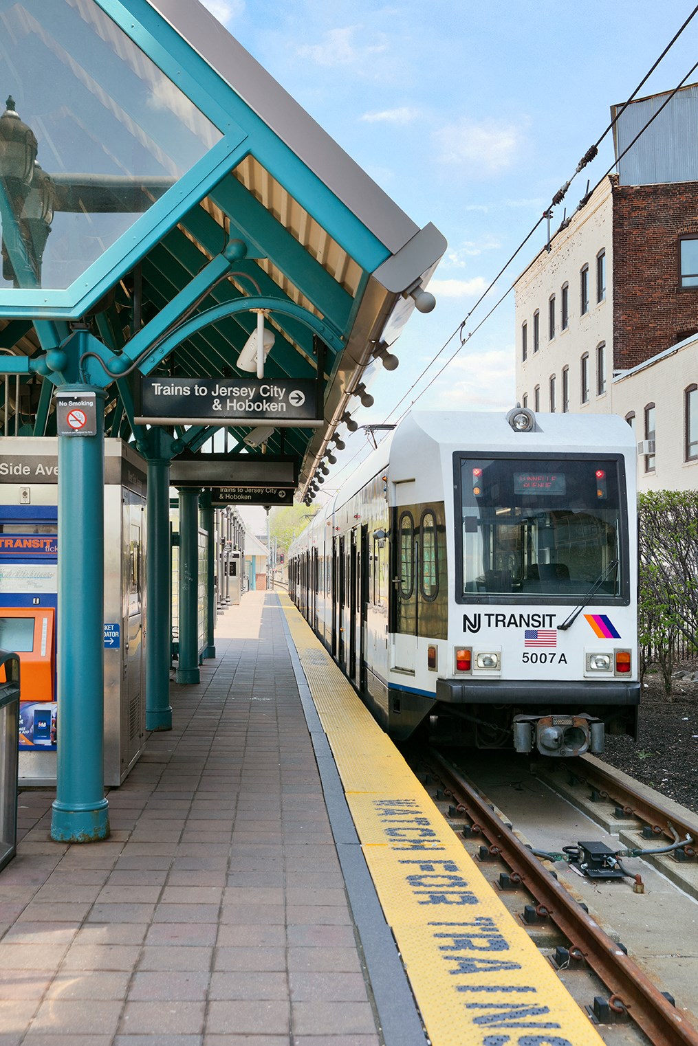 a train pulling up to a train station