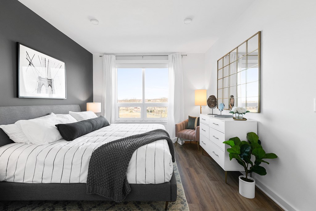 a bedroom with a bed and a dresser