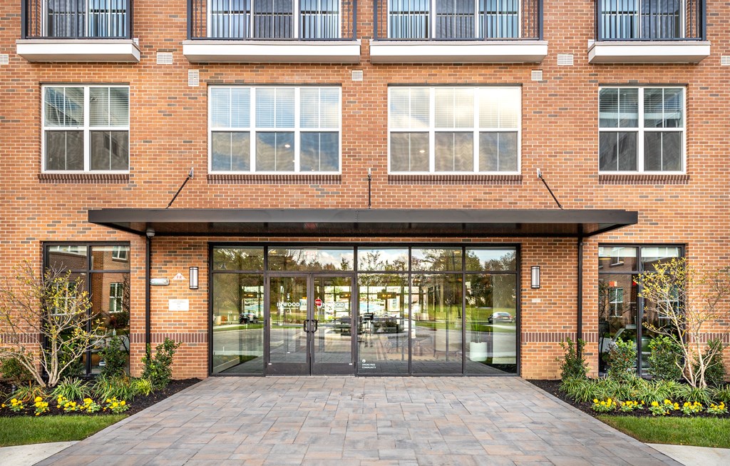 A red brick building with a glass entrance.