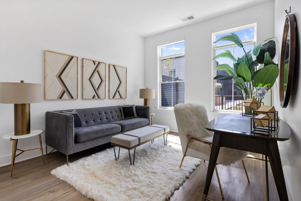 a living room with a couch and a dining table