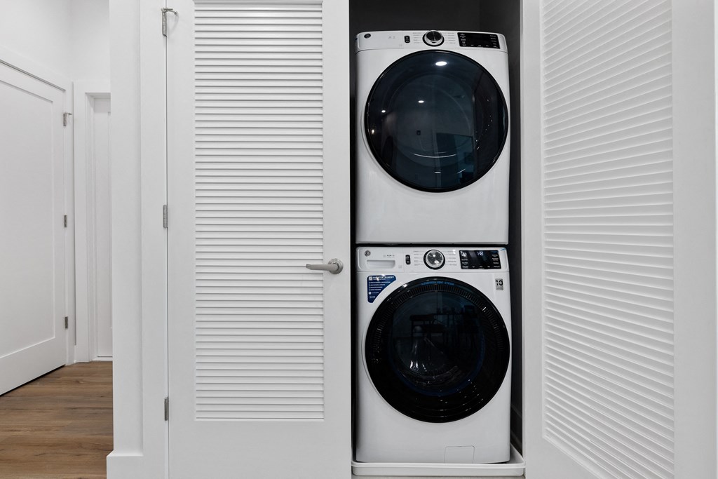 a front loading washer and dryer in a closet