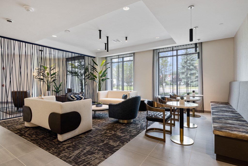 a living room with couches chairs and a table