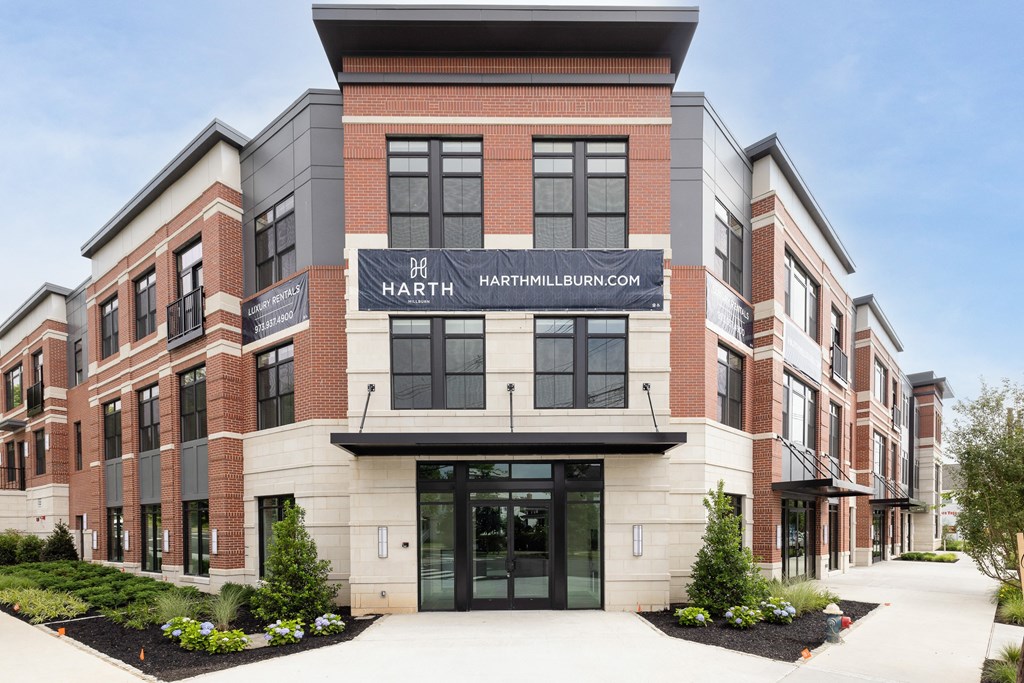 a brick building with a sign on the front of it