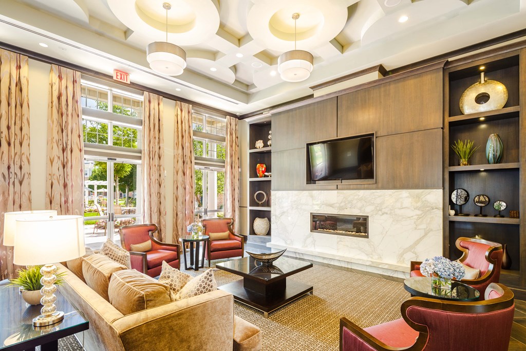 A living room with a fireplace and a television.