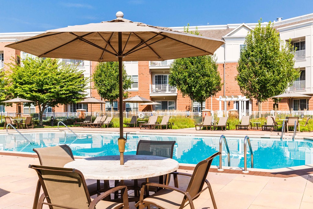 our apartments offer a swimming pool with patio furniture