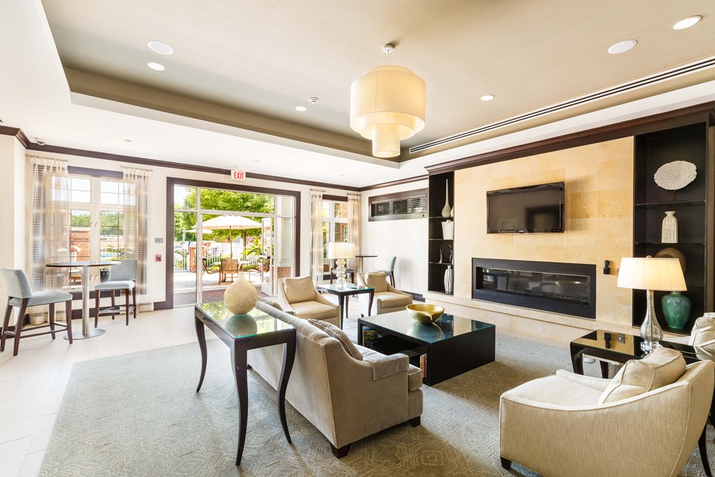 A living room with a fireplace and a television.