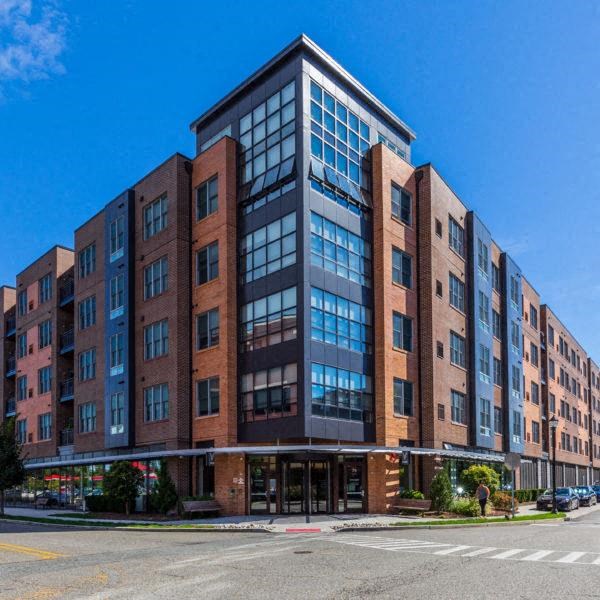 a large brick building on the corner of a street