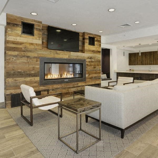 a living room with a fireplace and a couch