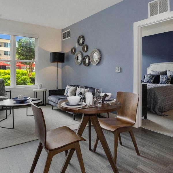 a living room with a table and a couch