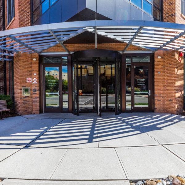 the entrance to a building with glass doors