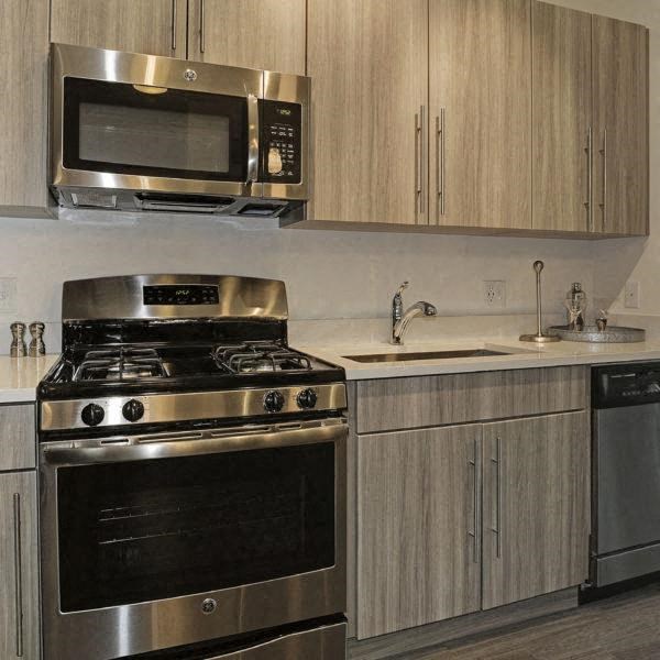 a kitchen with a stove and a microwave