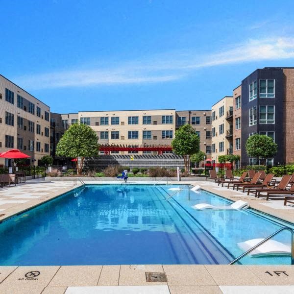 a swimming pool in the middle of an apartment building