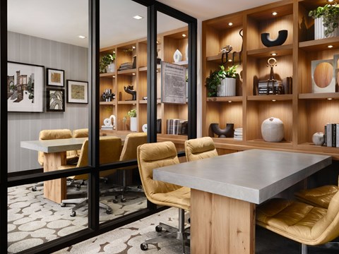 A conference room with a long table and chairs.
