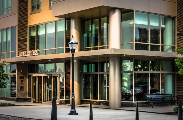 A building with a street lamp in front of it.