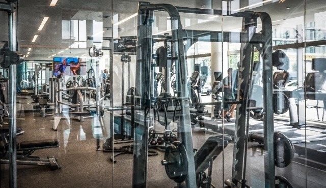 a gym with a lot of exercise equipment