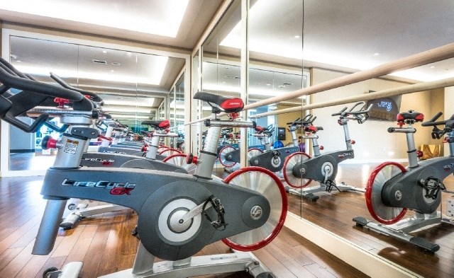 a gym with various exercise bikes and other exercise equipment