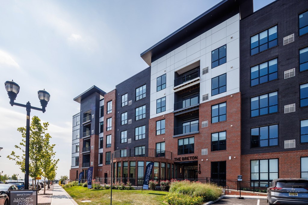 The Breton is a modern multi-story building with a mix of brick and glass exterior.