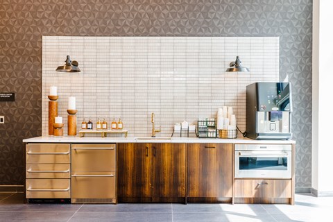 A modern kitchen with wooden cabinets and stainless steel appliances.
