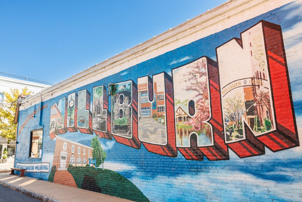 A mural on a building with the word "MARIE" painted on it.