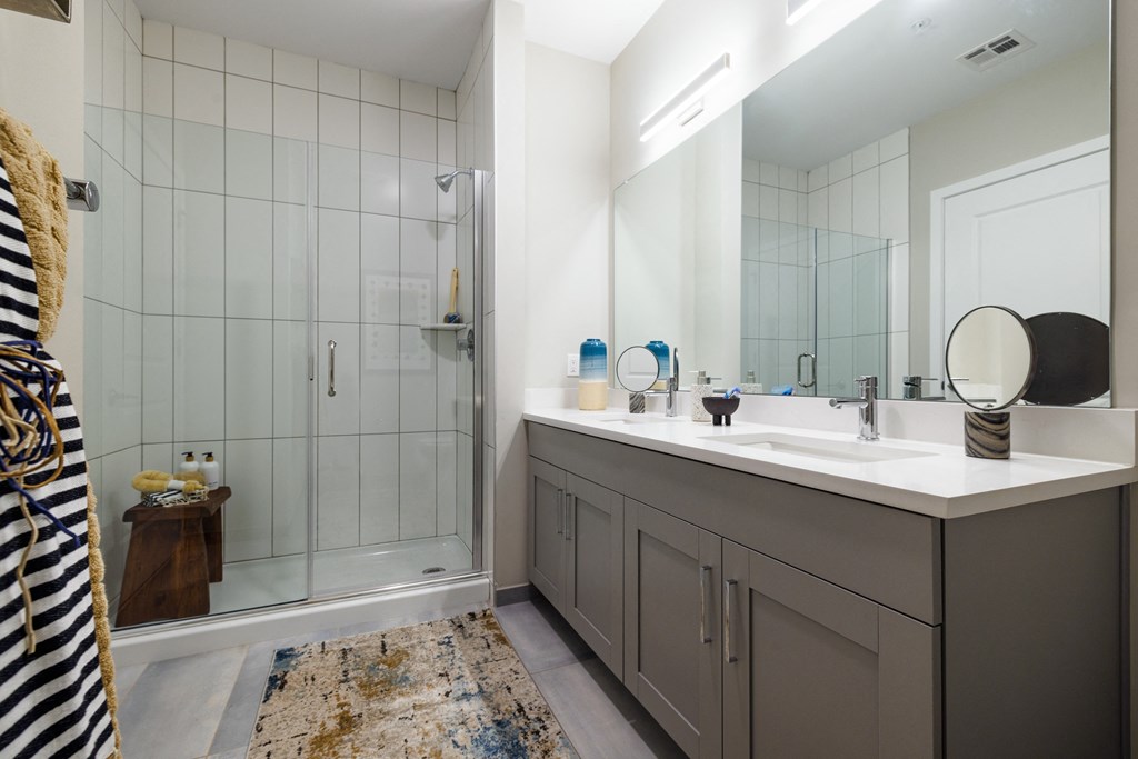 Bathrooms with Gray Shaker Vanities & Full Height Tiled Wet Walls