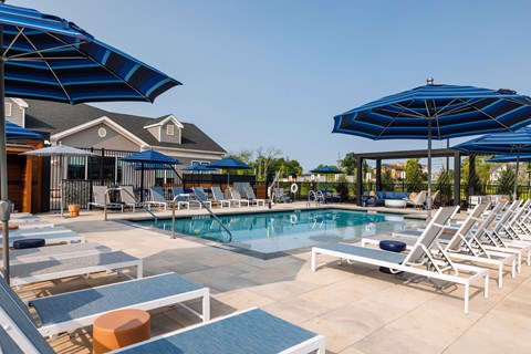 Expansive Outdoor Courtyard with Pool and Lounge Seating at The Hillmont, Hillsborough, NJ